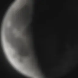 The waxing crescent moon illuminating the night sky